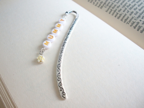 MUMMY in yellow letters & yellow flower on an engraved bookmark